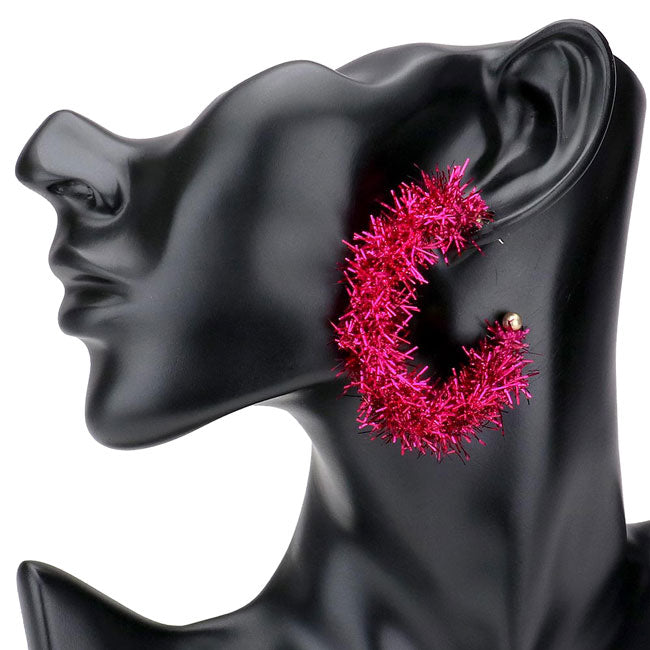 Fuchsia Christmas Post Back Tinsel Half Hoop Earrings. Get ready for Christmas with these tinsel earrings. Carry the spirit of Christmas with you wherever you go. Perfect for spreading the joy of the holiday season, add the right amount of shimmer & shine to your outfit. Awesome Christmas gift for your loved ones.