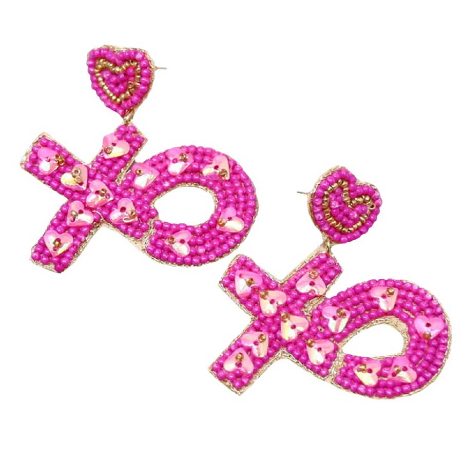 Fuchsia XOXO Seed Beaded Heart Drop Earrings, get ready with these XOXO drop earrings with any outfit! Embrace the valentine's day spirit with these awesome drop earrings. Accent all of your dresses with the extra fun vibrant color with these XOXO heart drop earrings. Enhance your attire with these vibrant artisanal earrings to show off your fun trendsetting style. 
