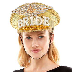 Gold Bride Message Accented Sequin Bling Hat. This visor hat with Bride Tribe Message is Open top design offers great ventilation and heat dissipation. Features a roll-up function; incredibly convenient as it is foldable for easy storage or for taking on the go while traveling. This Summer sun  hat is perfect for walking along the beach, hanging by the pool, or any other outdoor activities. 