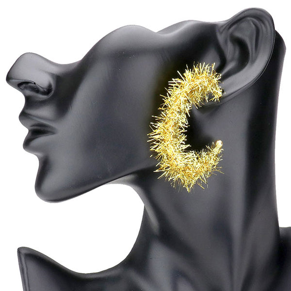 Gold Christmas Post Back Tinsel Half Hoop Earrings. Get ready for Christmas with these tinsel earrings. Carry the spirit of Christmas with you wherever you go. Perfect for spreading the joy of the holiday season, add the right amount of shimmer & shine to your outfit. Awesome Christmas gift for your loved ones.