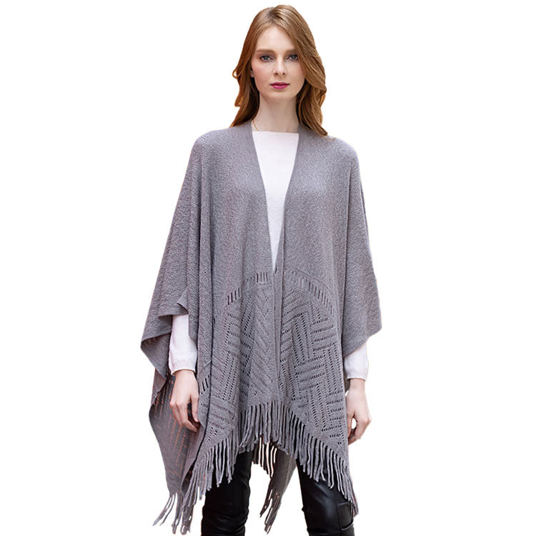 Gray Geometry Open Knit Ruana With Fringe. With this lovely ruana shawl, you can draw attention to the contrast of different outfits. Geometry Pattern With Fringe Design that Gives it a unique decorative and modern look. Match well with jeans and T-shirts or vest, A fashionable eye catcher, will quickly become one of your favorite accessories, warm and goes with all your winter outfits.