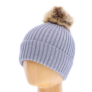 Gray Soft Knit Faux Pom Pom Beanie Hat. From daily life to holidays, this super stylish beanie hat's cozy fabric will keep you looking great and feeling warm. It's elegant, comfortable, and fashionable. Perfect for casual, trips, holidays, sports, skiing, skating, hiking, etc. or simply just for cold weather. 