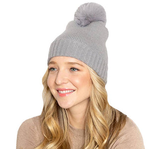 Gray Solid Knit Beanie Hat With Faux Fur Pom, accessorize the fun way with this faux fur pom solid knit beanie hat to keep yourself warm and toasty and enrich your beauty with luxe. The autumnal touch you need to finish your outfit in style. Awesome winter gift accessory! Perfect Gift for Birthdays, Christmas, holidays, anniversaries, and Valentine’s Day to your friends, family, and Loved Ones. 