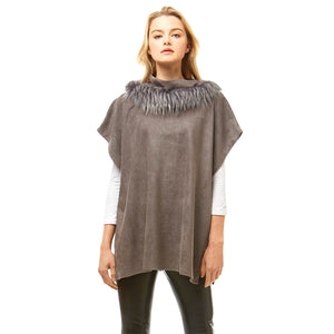 Gray Suede Feel Turtle Neck Faux Fur Poncho, is the perfect representation of beauty and comfortability for this winter. It is beautifully designed with a turtle neck that will amp up your beauty and keep you perfectly warm and toasty on cold and winter days. It goes with every winter outfit and gives you a unique yet beautiful outlook everywhere. It will be your perfect support to save you from cold and chill while going out in the cold weather.