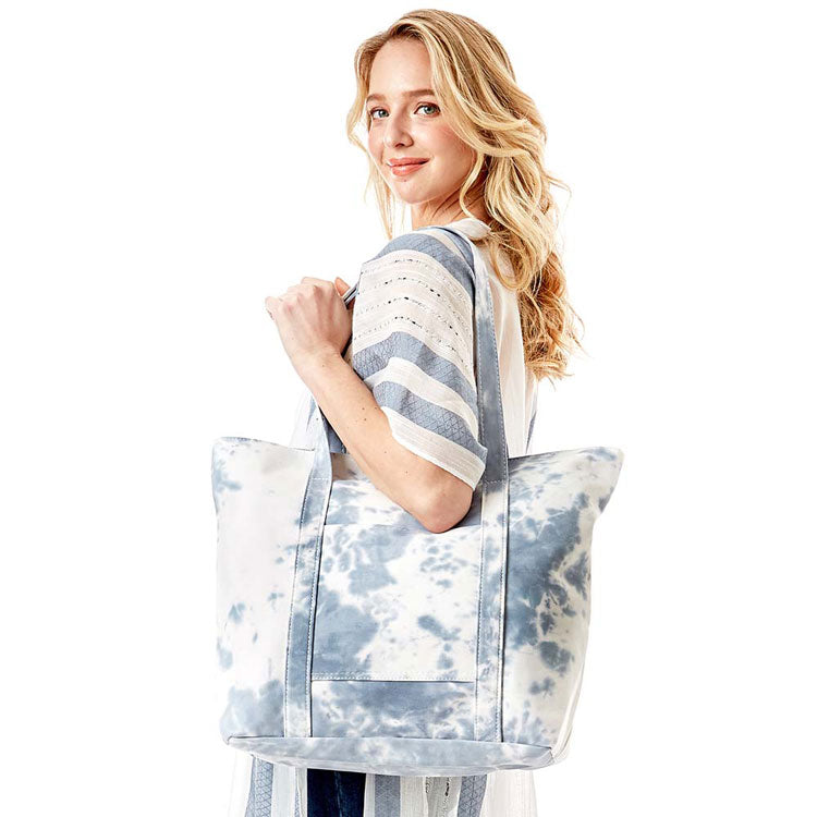 Blue Tie Dye Tote Bag, this bright tote bag is the perfect accessory. Whether you are out shopping, going to the pool or beach, this Tie Dye Tote bag is the perfect accessory. Spacious enough for carrying any and all of your outside essentials. The soft strap really helps carrying this tie dye shoulder bag comfortably.