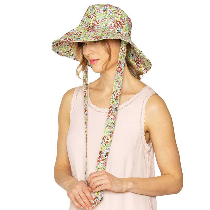 Green Flower Patterned Chin Tie Bucket Hat. Let your love for Summer bloom with these Bucket Hat. Packable and super convenient to carry, can also be easily carried inside your bags. Perfect for protecting you on a hot Summer day at the beach or keeping cool on the streets all while having your style completely intact!