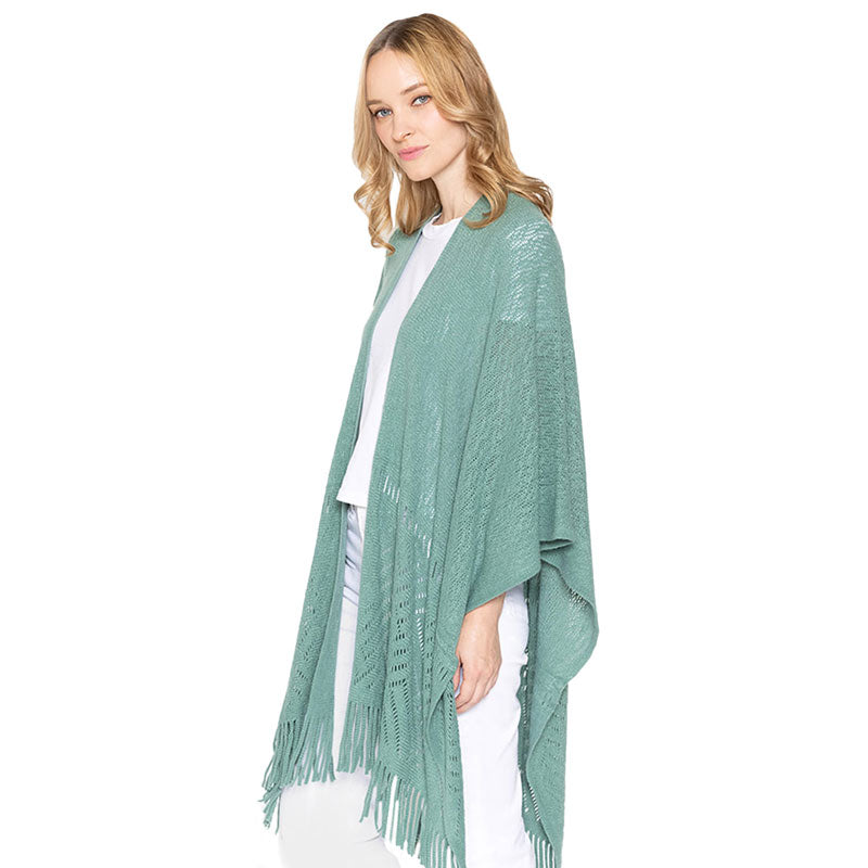 Green Geometry Open Knit Ruana With Fringe. With this lovely ruana shawl, you can draw attention to the contrast of different outfits. Geometry Pattern With Fringe Design that Gives it a unique decorative and modern look. Match well with jeans and T-shirts or vest, A fashionable eye catcher, will quickly become one of your favorite accessories, warm and goes with all your winter outfits.