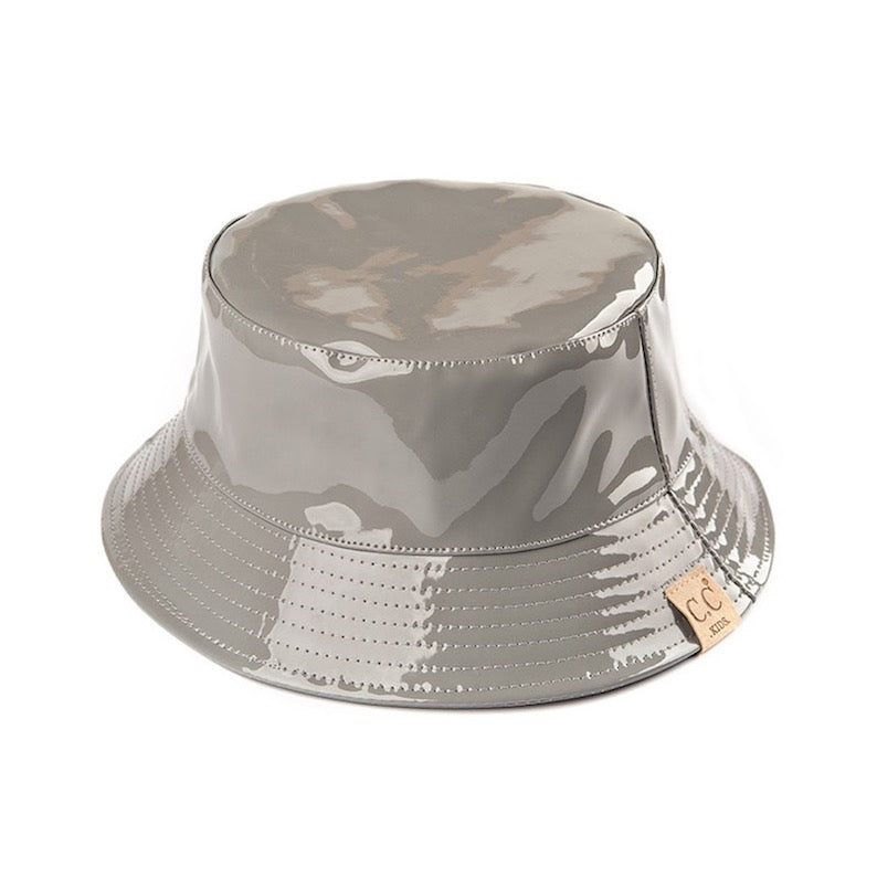 Grey C.C Kids Shiny Solid Color Reflective Enamel Detailed Rain Bucket Hat; this rain hat is snug on the head and works well to keep rain off the head, out of the eyes, and also the back of the neck. Wear it to lend a modern liveliness above a raincoat on trans-seasonal days in the city. Perfect Gift for that fashion-forward friend