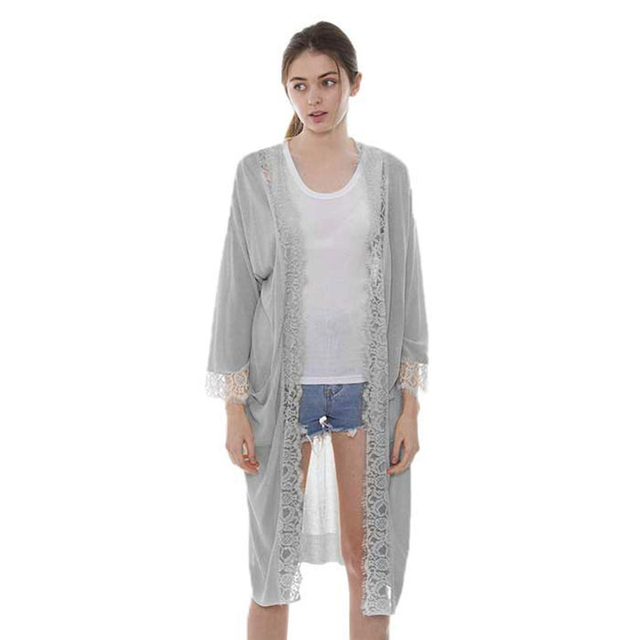 Grey Solid Lace Hem Pockets in Front Long Cardigan. Delicate open front floral lace beach cover-up featuring wide sleeves and hip length. Beach or Poolside chic is made easy with this lightweight cover-up featuring flower detail and a relaxed silhouette, look perfectly breezy and laid-back as you head to the beach. Also an accessory easy to pair with so many tops! From stylish layering camis to relaxed tees, you can throw it on over so many pieces elevating any casual outfit! Great gift idea.