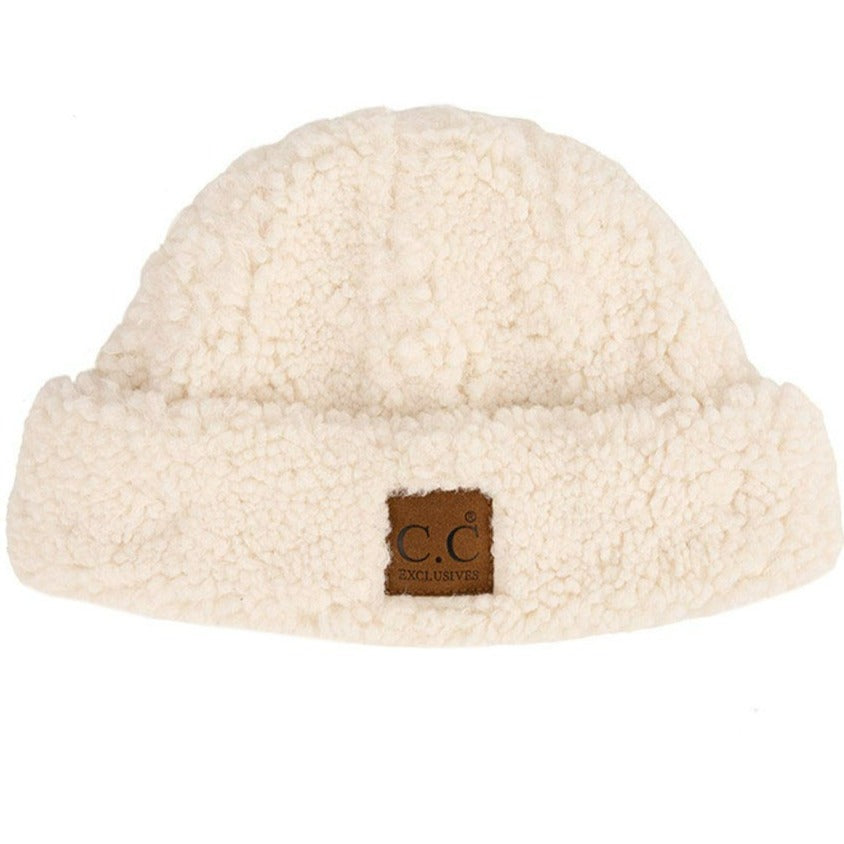 Ivory C C Sherpa Cuff Beanie Hat with C C Suede Logo, wear this beautiful Beanie Hat while going outdoors and keep yourself warm and stylish with a unique look. The color variation makes the Hat suitable for everyone's choice with different outfits. It feels cozy and a perfect match for any type of outfit. It's a beautiful winter gift accessory for birthdays, Christmas, stocking stuffers, secret Santa, holidays, etc.