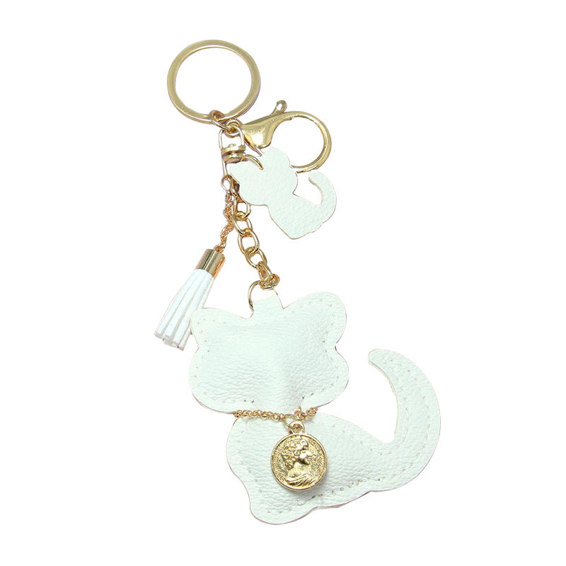 Ivory Faux Leather Cat Tassel Key Chain, a cat key chain! Made with Tassel, this keychain is the best to carry around the keys to your treasure box or your Cat hideout! Make your close ones feel special and make them laugh. You can give this cat key chain as a gift to your loved one.