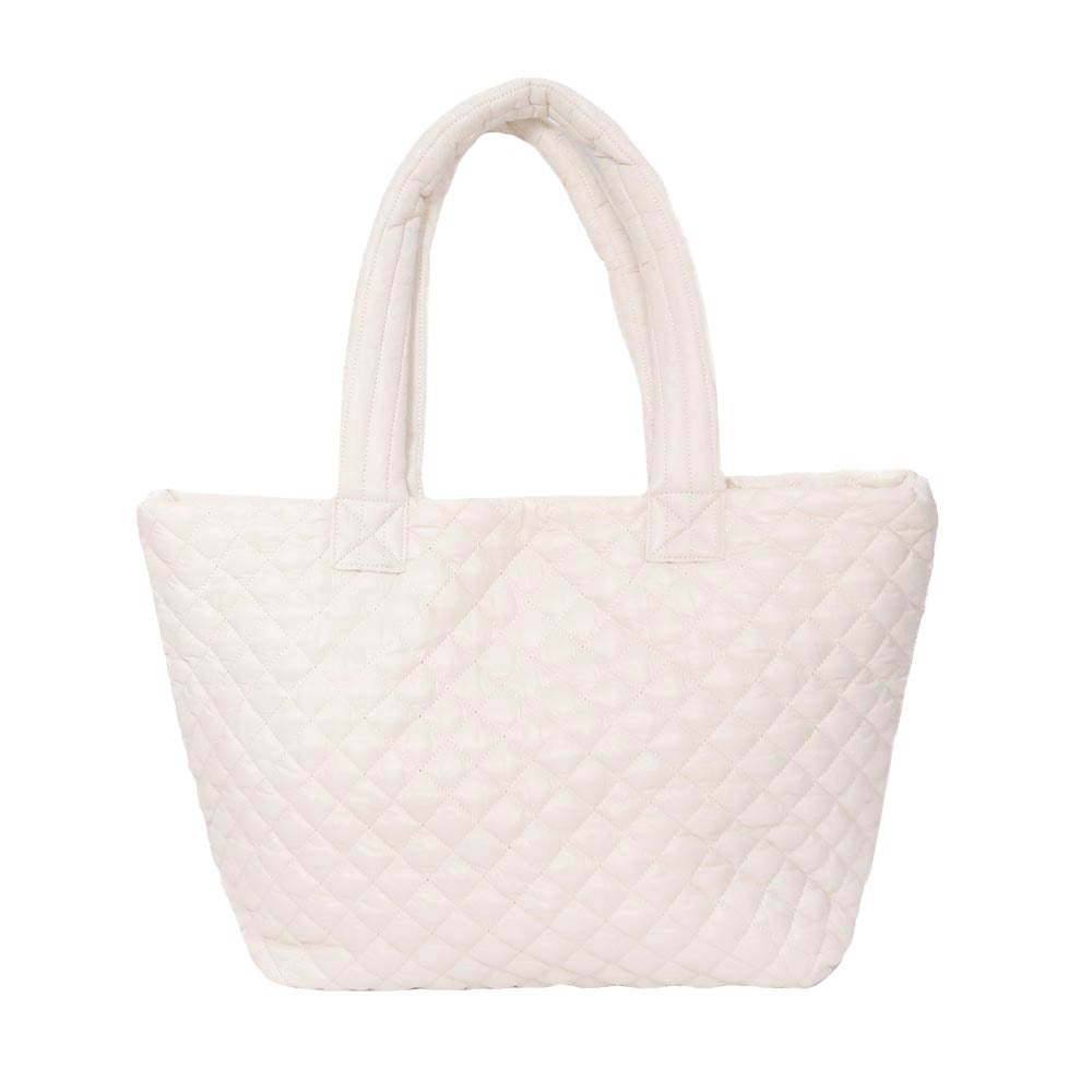 Ivory Quilted Padded Puffer Tote Bag, has plenty of room to carry all your handy items with ease. Trendy and beautiful bag that amps up your outlook while carrying. Great for different activities including quick getaways, holidays, Shopping, beach, or even going outdoors! This tote bag features a top zipper closure for security that makes your life easier and trendier. Its catchy and awesome appurtenance drags everyone's attraction to you. 