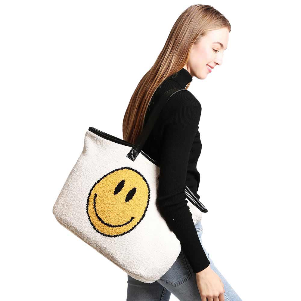 Ivory Smile Face Tote Bag, Add a unique, beautiful, and trendy style to your look with this smile face tote bag for women. This fashionable handbag has a casual-cool silhouette that is structured, stylish, and ultra-comfortable. An adjustable strap and top handle elevate the structured style of this handbag. This spacious handbag features a roomy interior to hold all your essentials. It’s safe, secure, and great for travel. 