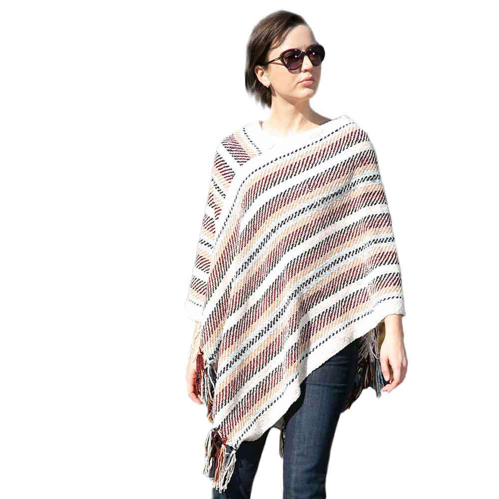 Ivory Stripe Patterned Poncho, stripped designed beauty gives your outlook more gorgeousness and will make your day. It fits from stylish layering camis to relaxed tees. It will keep the body perfectly warm and represents your awesome look everywhere. It will become your favorite accessory.