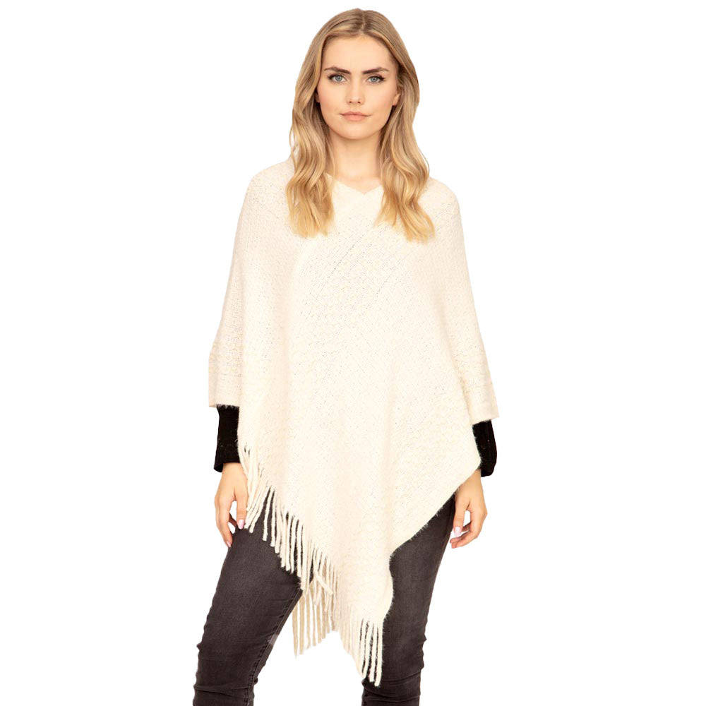 Black Striped Knit Tassel Poncho, is the perfect accessory that amps up your confidence with perfect beauty adding the right amount of luxe to your ensemble. It's a luxurious, trendy, super soft chic capelet that keeps you warm and toasty on cold days and winter. From stylish layering camis to relaxed tees, you can throw it on over so many pieces elevating any casual outfit!