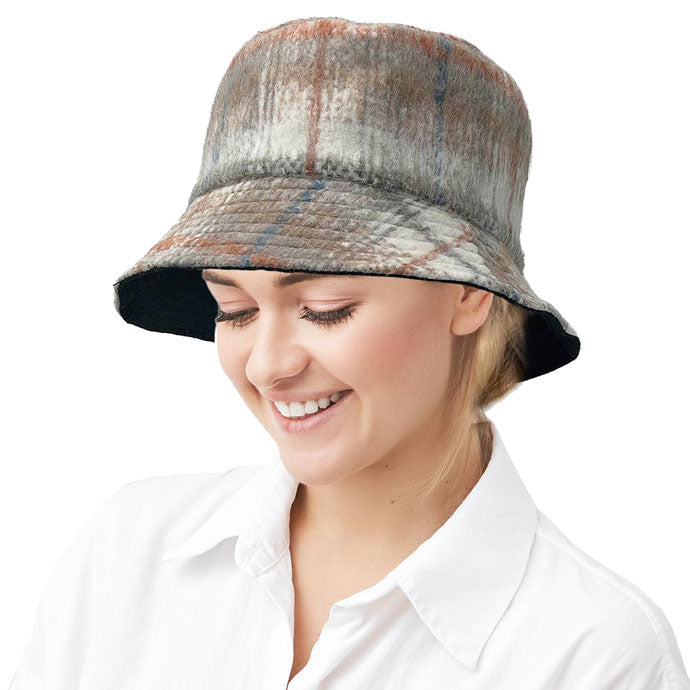 Ivory Polyester Plaid Check Patterned Bucket Hat, this bucket hat doubles as a rain hat and is snug on the head and stays on well. It will work well to keep the rain off the head and out of the eyes and also the back of the neck. Wear it to lend a modern liveliness above a raincoat on trans-seasonal days in the city.