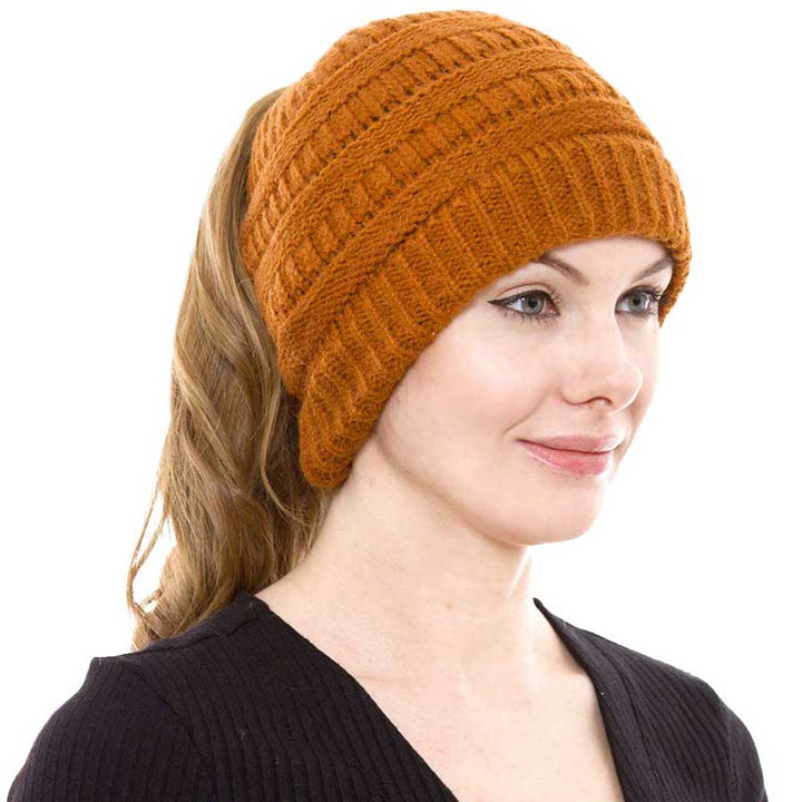 Khaki Cable Knit Ponytail Beanie Hat, Perfect for pulling your messy bun or high ponytail, while keeping ears warm. Great to wear while exercising in cold weather to keep your hair up and your head warm. It's the autumnal touch you need to finish your outfit in style. The cable knit hat can be used on your working day, You can also wear it in outdoor sports: running, biking etc. Awesome winter gift accessory!