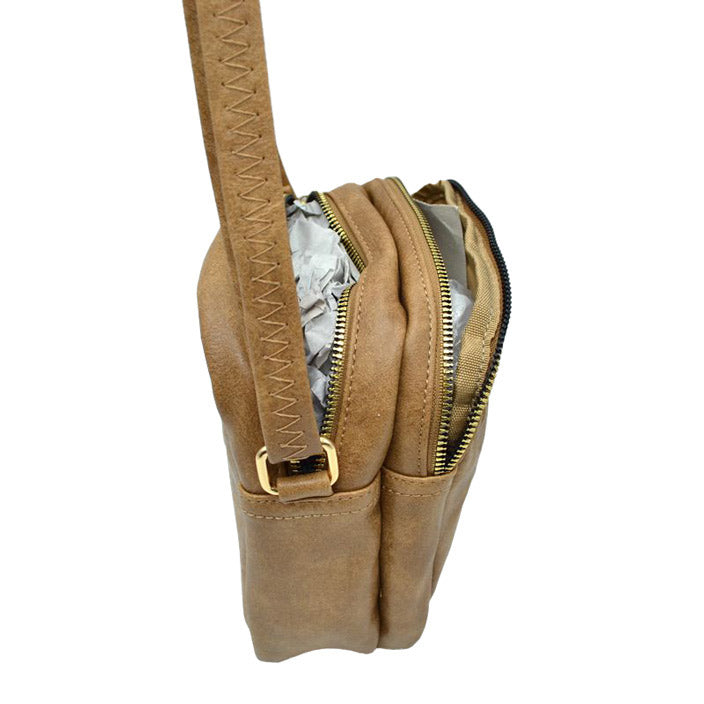 Khaki Trendy Leather Crossbody Bag With Shoulder Strap, Be trendy and casual with this beautifully crafted crossbody bag. This premium-looking bag is made up of genuine leather, making it perfect for carrying when heading to the office or casual parties. This bag features a flexible shoulder strap and zipper closure and has spacious space to place all your stuff. Stay trendy!