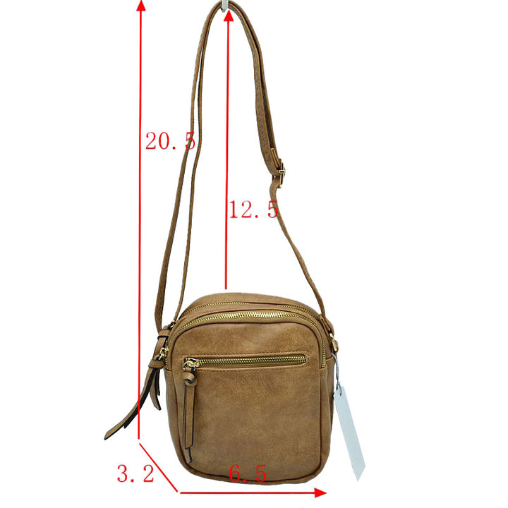 Khaki Trendy Leather Crossbody Bag With Shoulder Strap, Be trendy and casual with this beautifully crafted crossbody bag. This premium-looking bag is made up of genuine leather, making it perfect for carrying when heading to the office or casual parties. This bag features a flexible shoulder strap and zipper closure and has spacious space to place all your stuff. Stay trendy!