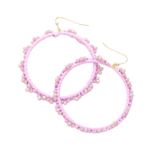 Lavender Beaded Pointed Raffia Wrapped Open Circle Dangle Earrings, enhance your attire with these beautiful raffia-wrapped dangle earrings to show off your fun trendsetting style. It can be worn with any daily wear such as shirts, dresses, T-shirts, etc. These raffia open-circle dangle earrings will garner compliments all day long. Whether day or night, on vacation, or on a date, whether you're wearing a dress or a coat, these earrings will make you look more glamorous and beautiful. 