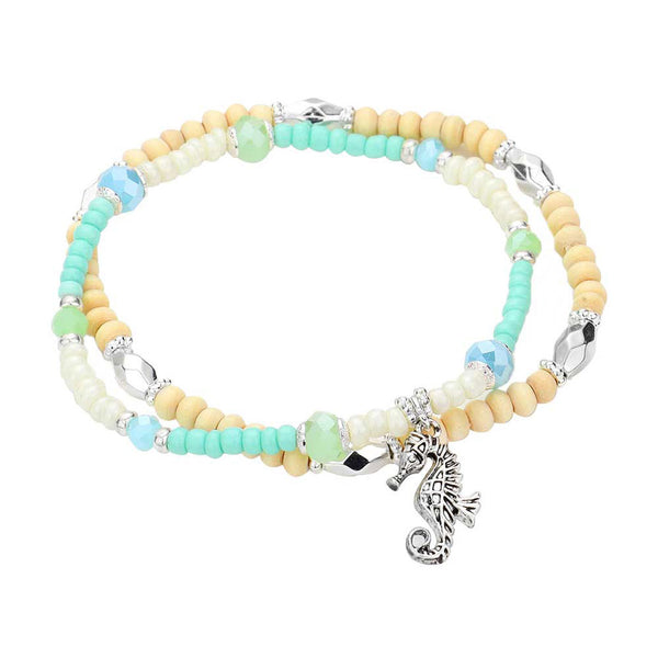 Mint Seahorse Charm Wood Seed Beaded Stretch Bracelets. This sea-themed bracelet features a parade of marine creatures for a fun, beachy vibe. With a polished finish and lifelike details. A timeless and traditional Holiday, Anniversary gift, Birthday gift, Valentine's Day gift for a woman or girl of any age.