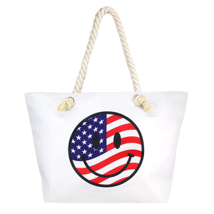 Multi White USA Flag In Smile Face Print Beach Tote Bag, Tote your beach-bound essentials in a patriotic style tote done with an USA flag exterior. Show your love for Your country with this sweet patriotic USA flag in smile face Print tote bag. Red, white, and blue are used for a trendy fireworks flare. Whether you're shopping, heading to the pool, or the beach, this USA flag in smile face  Print tote bag is the perfect accessory.
