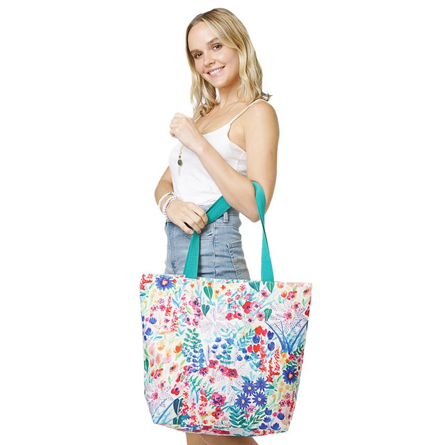 Multi Flower Patterned Beach Tote Bag, Sturdy and stylish with a flower patterned tote bag. Whether you are out shopping or going to the pool or beach, this flower-patterned tote bag is the perfect accessory. Perfectly lightweight to carry around all day. Spacious enough for carrying any of your hangout essentials. 