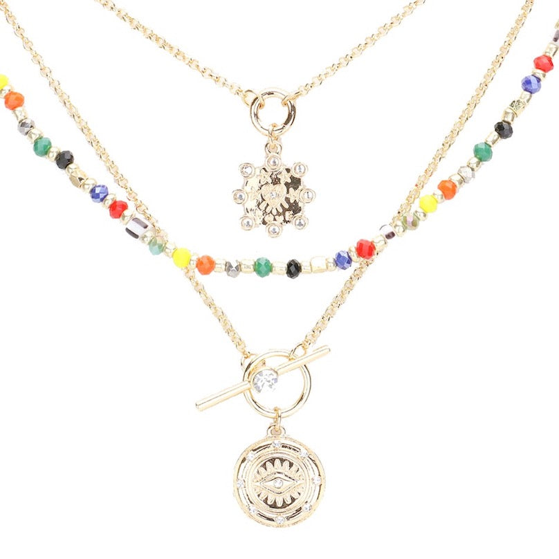Multi Stone Embellished Evil Eye Charm Round Pendant Multi Layered Necklaces; when someone eyes your good fortune with jealousy or gluttony, the evil eye necklace is a known symbol to protect & ward off negative energy. Great gift: Vacation, Birthday, Anniversary, Christmas, Just Because, Valentine's, Mother's day, Easter