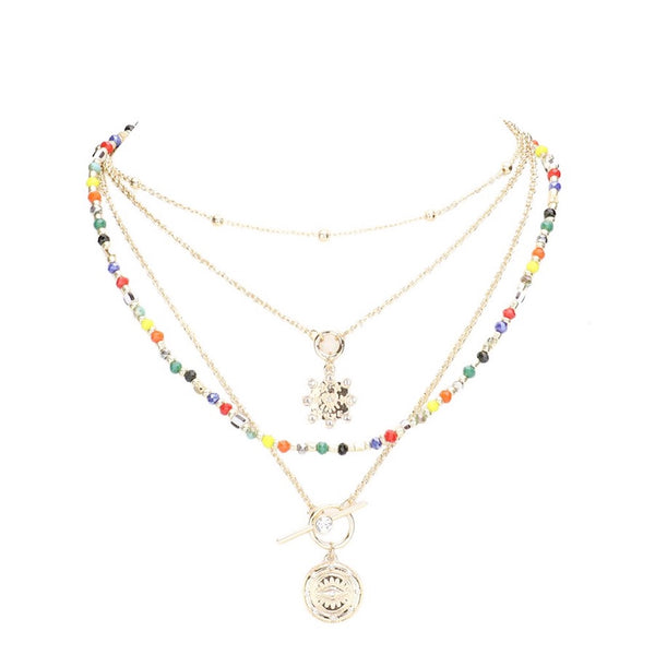 Multi Stone Embellished Evil Eye Charm Round Pendant Multi Layered Necklaces; when someone eyes your good fortune with jealousy or gluttony, the evil eye necklace is a known symbol to protect & ward off negative energy. Great gift: Vacation, Birthday, Anniversary, Christmas, Just Because, Valentine's, Mother's day, Easter