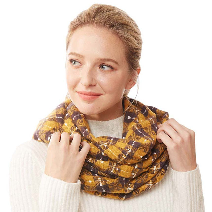 Mustard Plaid Check Infinity Super Soft Scarf, is a beautiful addition to your attire. The attractive plaid pattern makes this scarf awesome to amp up your beauty to a greater extent. It perfectly adds luxe and class to your ensemble. Absolutely amplifies the glamour with a plush material that feels amazing snuggled up against your cheeks. It's a versatile choice and can be worn in many ways with any outfit. A beautiful gift for your Wife, Mom, and your beloved ones