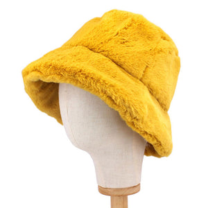 Mustard Polyester Faux Fur Bucket Hat, stay warm and cozy, protect yourself from the cold, this most recongizable look with remarkable bold, soft & chic bucket hat, features a rounded design with a short brim. The hat is foldable, great for daytime. Perfect Gift for cold weather!