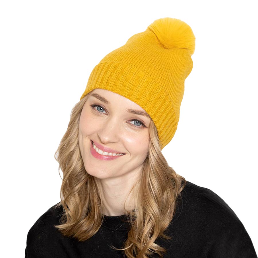 Mustard Solid Knit Beanie Hat With Faux Fur Pom, accessorize the fun way with this faux fur pom solid knit beanie hat to keep yourself warm and toasty and enrich your beauty with luxe. The autumnal touch you need to finish your outfit in style. Awesome winter gift accessory! Perfect Gift for Birthdays, Christmas, holidays, anniversaries, and Valentine’s Day to your friends, family, and Loved Ones. 