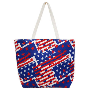 Navy American USA Flag Printed Beach Tote Bag. Tote your beach-bound essentials in patriotic style tote done with an American Flag exterior. Keep your essentials safe on the move while still having standout style, roomy enough for toting all your items for a day out, whether its a day at the beach or poolside. 