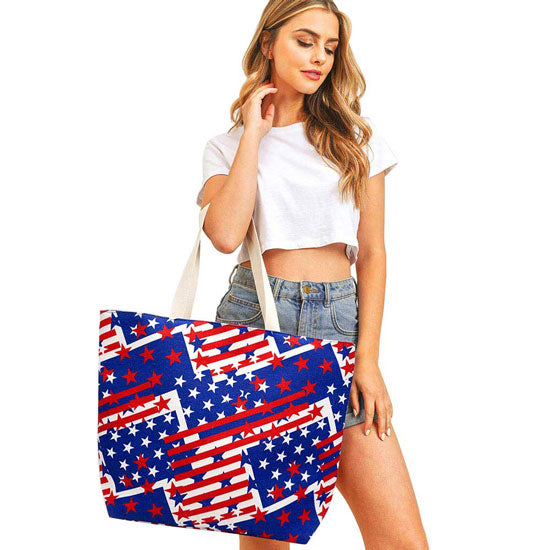 Navy American USA Flag Printed Beach Tote Bag. Tote your beach-bound essentials in patriotic style tote done with an American Flag exterior. Keep your essentials safe on the move while still having standout style, roomy enough for toting all your items for a day out, whether its a day at the beach or poolside. 