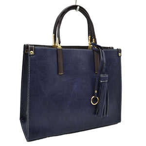 Navy Blue Large Shoulder Vegan Leather Tassel Handbag For Women. High quality Vegan Leather is a luxurious and durable, Stay organized in style with this square-shaped shopper tote bag that is fully two contrasting interior and exterior solid colors. This vegan leather handbag includes an on-trend removable tassel embellishment. Guaranteed, This will be your go-to handbag. 