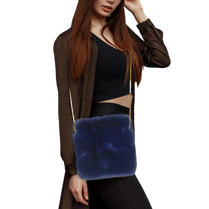 Navy Faux Fur Square Crossbody Bag, amps up your beauty with any outfit and makes your confidence high. Take it before going out with all of your handy items in it. It's cute and very much comfortable. Lightweight and easy to carry. Simple yet awesome and comes with a strap for easy carrying. This eye-catchy bag is the perfect accessory for carrying makeup, money, credit cards, keys or coins, etc. handy items. Put it in your bag and find it quickly with its bright colors. 