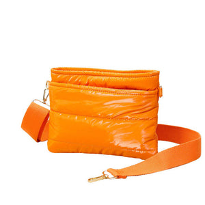 Orange Glossy Solid Puffer Crossbody Bag, Complete the look of any outfit on all occasions with this Shiny Puffer Crossbody Bag. This Puffer bag offers enough room for your essentials. With a One Front Zipper Pocket, One Back Zipper Pocket, and a Zipper closure at the top, this bag will be your new go-to! The zipper closure design ensures the safety of your property. The widened shoulder straps increase comfort and reduce the pressure on the shoulder.
