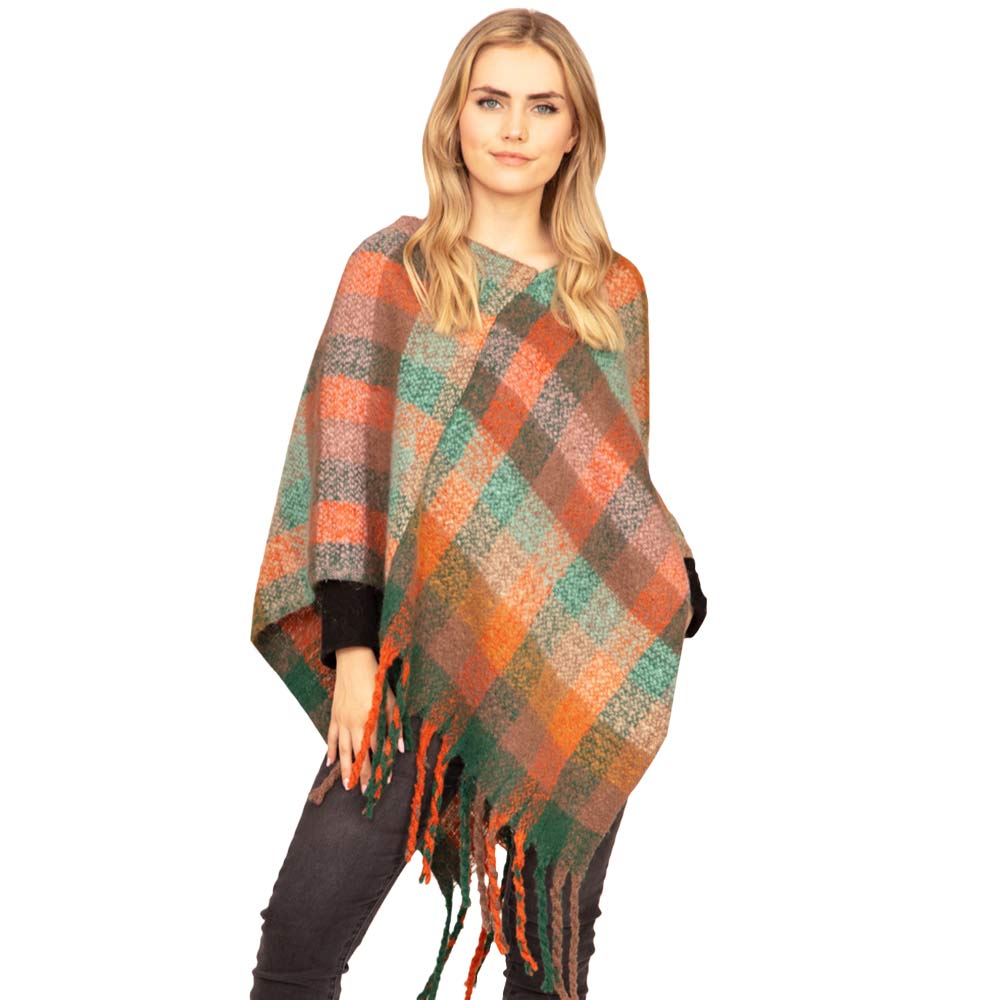Orange Trendy Plaid Check Patterned Poncho, is absolutely beautiful wear to make you stand out and keep you warm and toasty in the cold weather or winter. It ensures your upper body keeps perfectly toasty when the temperatures drop. It's the timelessly beautiful poncho that gently nestles around the neck and feels exceptionally comfortable to wear. Attractive and eye-catchy fashion wear that will quickly become one of your favorite accessories for daily wear in winter.