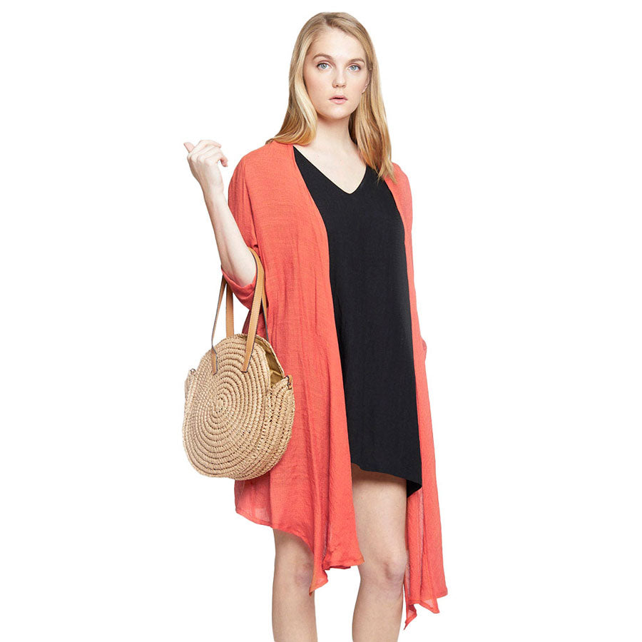 Peach Solid Long Cardigan. Delicate open front floral lace beach cover-up featuring wide sleeves and hip length. Beach or Poolside chic is made easy with this lightweight cover-up featuring flower detail and a relaxed silhouette, look perfectly breezy and laid-back as you head to the beach. Also an accessory easy to pair with so many tops! From stylish layering camis to relaxed tees, you can throw it on over so many pieces elevating any casual outfit! Great gift idea.