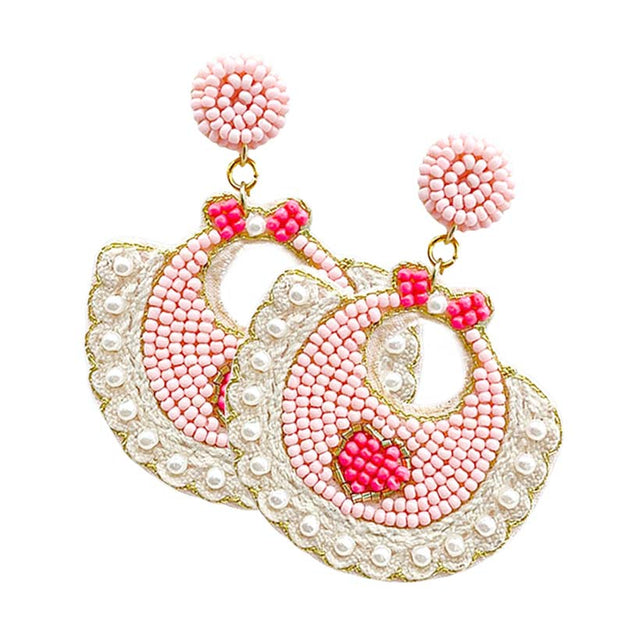 Pink Felt Back Pearl Beaded Baby Bib Dangle Earrings, these fun-crafted baby bib dangle earrings are a sign of fashion trends, styles, and innovations. These beautiful pearl beaded earrings are gorgeous and unique that will dangle on your earlobes to make you stand out from the crowd. These pearl earrings will dangle on your earlobes to show the perfect class and make others smile with joy.