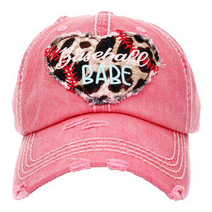Pink Baseball Babe Leopard Patterned Heart Vintage Baseball Cap. Fun cool message themed vintage baseball cap. Perfect for walks in sun, great for a bad hair day. The distressed frayed style with faded colour gives it an awesome vintage look. Soft textured, embroidered message with fun statement will become your favourite cap.