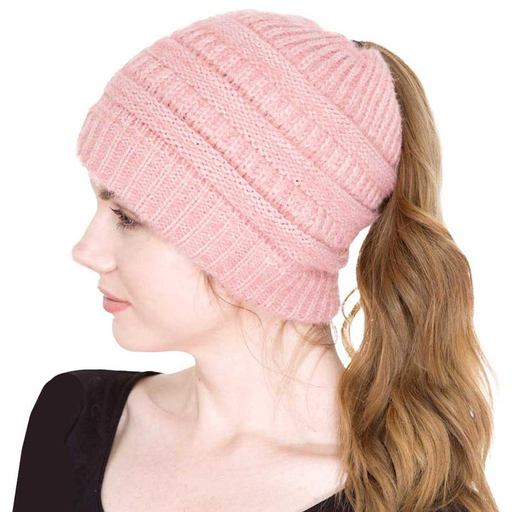 Pink Cable Knit Ponytail Beanie Hat, Perfect for pulling your messy bun or high ponytail, while keeping ears warm. Great to wear while exercising in cold weather to keep your hair up and your head warm. It's the autumnal touch you need to finish your outfit in style. The cable knit hat can be used on your working day, You can also wear it in outdoor sports: running, biking etc. Awesome winter gift accessory!