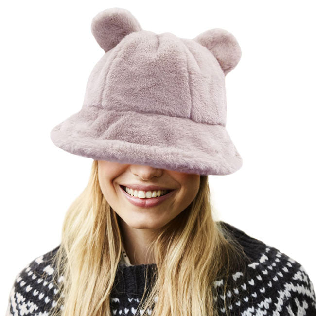 Pink Faux Fur Bear Ear Bucket Hat, Show your excellent choice with this chic Faux Fur bear Bucket Hat. This animal themed bucket hat is nicely designed and a great addition to your attire. Have fun and look Stylish anywhere outdoors. Great for covering up when you are having a bad hair day. Perfect for protecting you from the wind, snow, beach, pool, camping, or any outdoor activities in cold weather. Amps up your outlook with confidence with this trendy bucket hat. 
