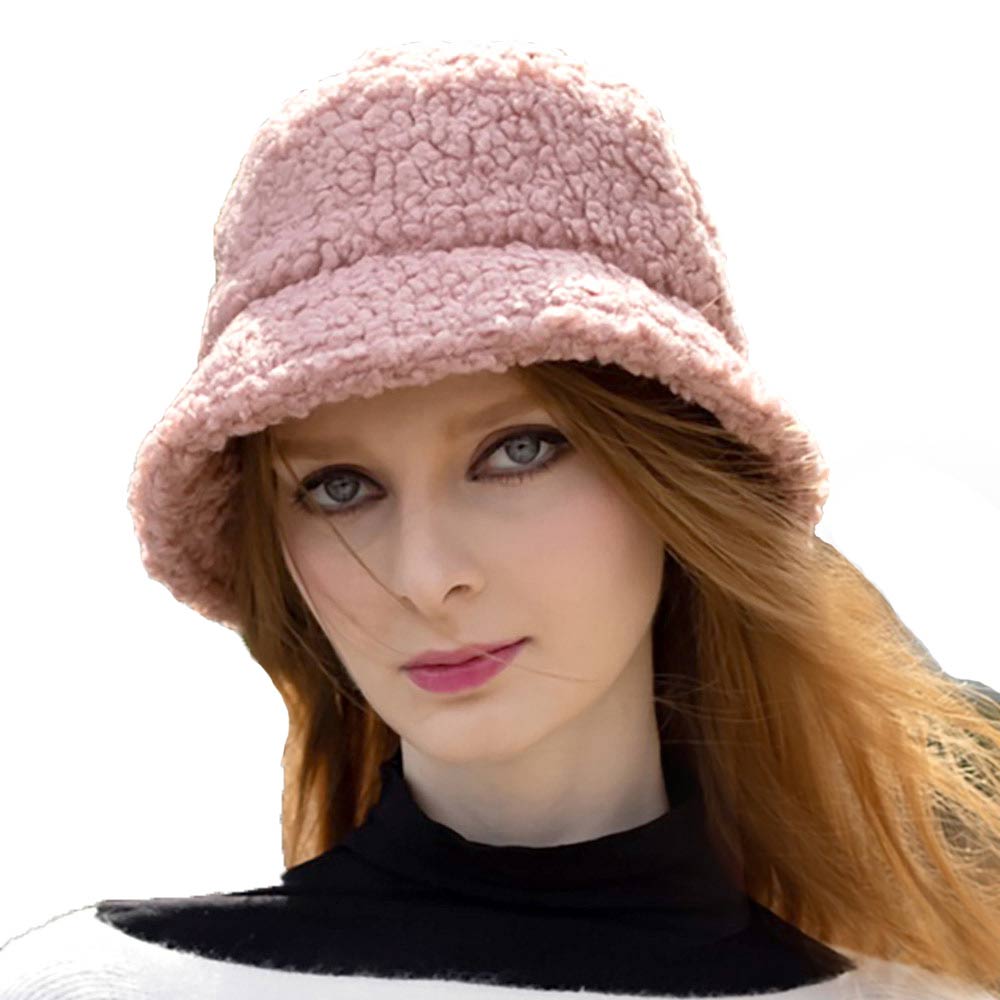 Pink Faux Fur Sherpa Bucket Hat, this bucket hat is a comfy & cozy hat and is snug on the head and stays on well to make your day perfect. It will work well to keep you comfortable and the sun out of the eyes and also the back of the neck. Wear it to lend a modern liveliness above an outfit on trans-seasonal days in the city to give yourself a unique look. Stay trendy and beautiful.
