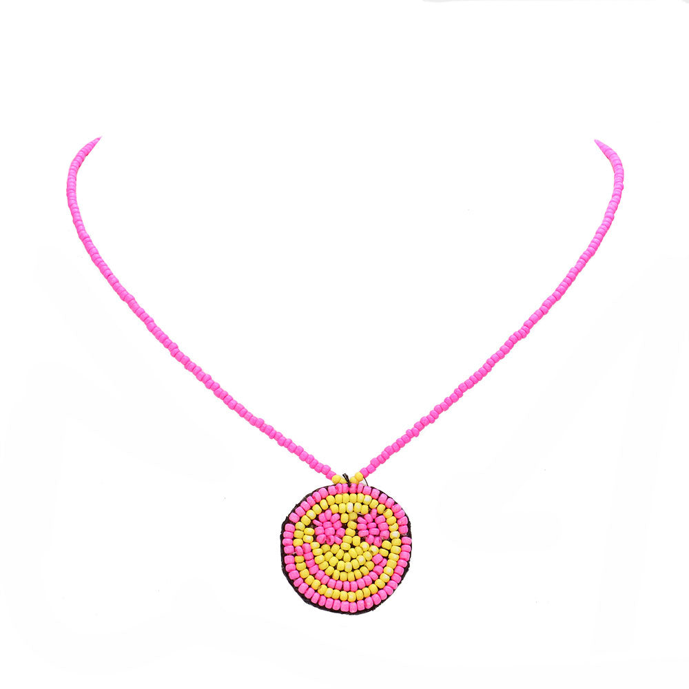 Pink Felt Back Seed Beaded Smile Pendant Necklace, this beautiful Smile-themed pendant necklace is the ultimate representation of your class & beauty.  Perfect for adding just the right amount of shine and a touch of class this any happy moments. Perfect gift for Birthdays, valentine's day & other meaningful occasions.