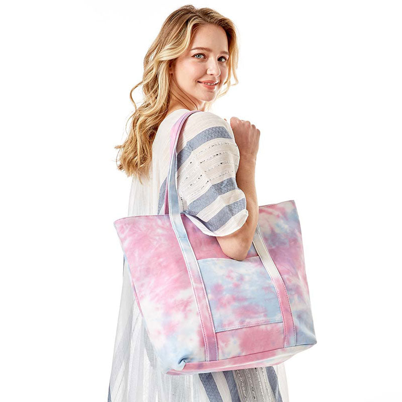 Pink Tie Dye Tote Bag, this bright tote bag is the perfect accessory. Whether you are out shopping, going to the pool or beach, this Tie Dye Tote bag is the perfect accessory. Spacious enough for carrying any and all of your outside essentials. The soft strap really helps carrying this tie dye shoulder bag comfortably.