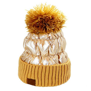 Brown Puffer Knit Pom Pom Glossy Winter Cozy Beanie Hat. Before running out the door into the cool air, you’ll want to reach for this toasty beanie to keep you incredibly warm. Accessorize the fun way with this puffer knit hat, it's the autumnal touch you need to finish your outfit in style. Awesome winter gift accessory!