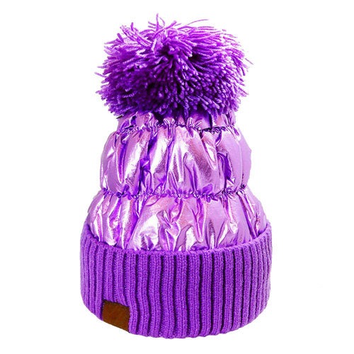 Purple Puffer Knit Pom Pom Glossy Winter Cozy Beanie Hat. Before running out the door into the cool air, you’ll want to reach for this toasty beanie to keep you incredibly warm. Accessorize the fun way with this puffer knit hat, it's the autumnal touch you need to finish your outfit in style. Awesome winter gift accessory!