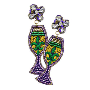 Purple Mardi Gras Felt Back Fleur de Lis Pointed Beaded Wine Dangle Earrings, is a unique and beautiful collection of earrings for your attire for this Mardi Gras event. These Fleur de Lis-themed earrings are beautifully designed with beaded wine to dangle on your earlobes with a perfect glow. Wear these beautiful Mardi Gras-themed beaded earrings to get immediate compliments.