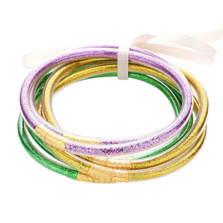 Purple Multi 6PCS Glitter Jelly Tube Bangle Bracelets, are a beautiful & unique collection to your attire to make your look more attractive. Wear these beautiful glitter bracelets as formal or casual wear to make you stand out at a party, work, or shopping. The bracelet is filled with enough glitter & it sparkles in the light. These beautiful bracelets will help you to get more compliments on your everyday wear
